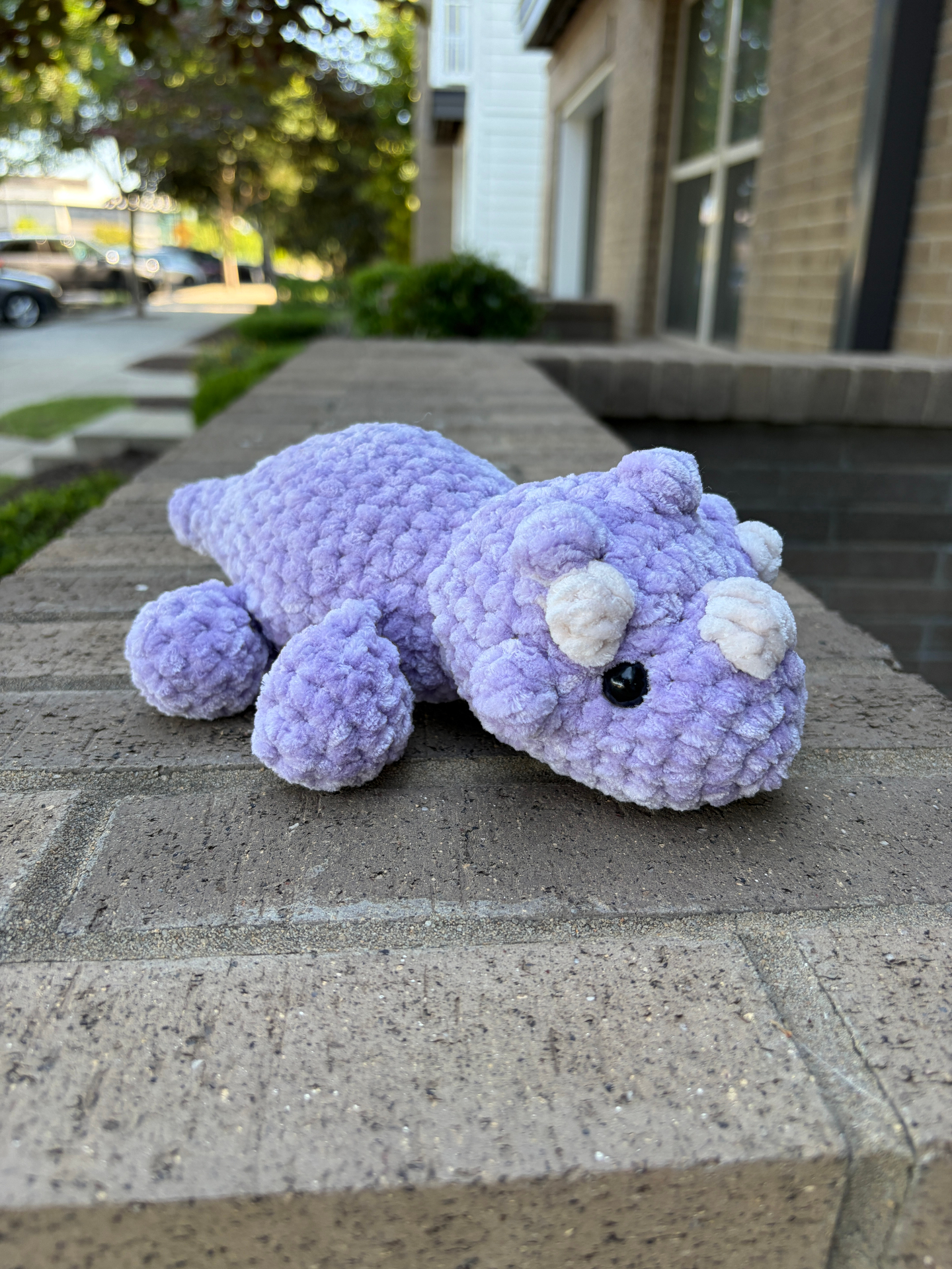 Purple crochet triceratops plushie