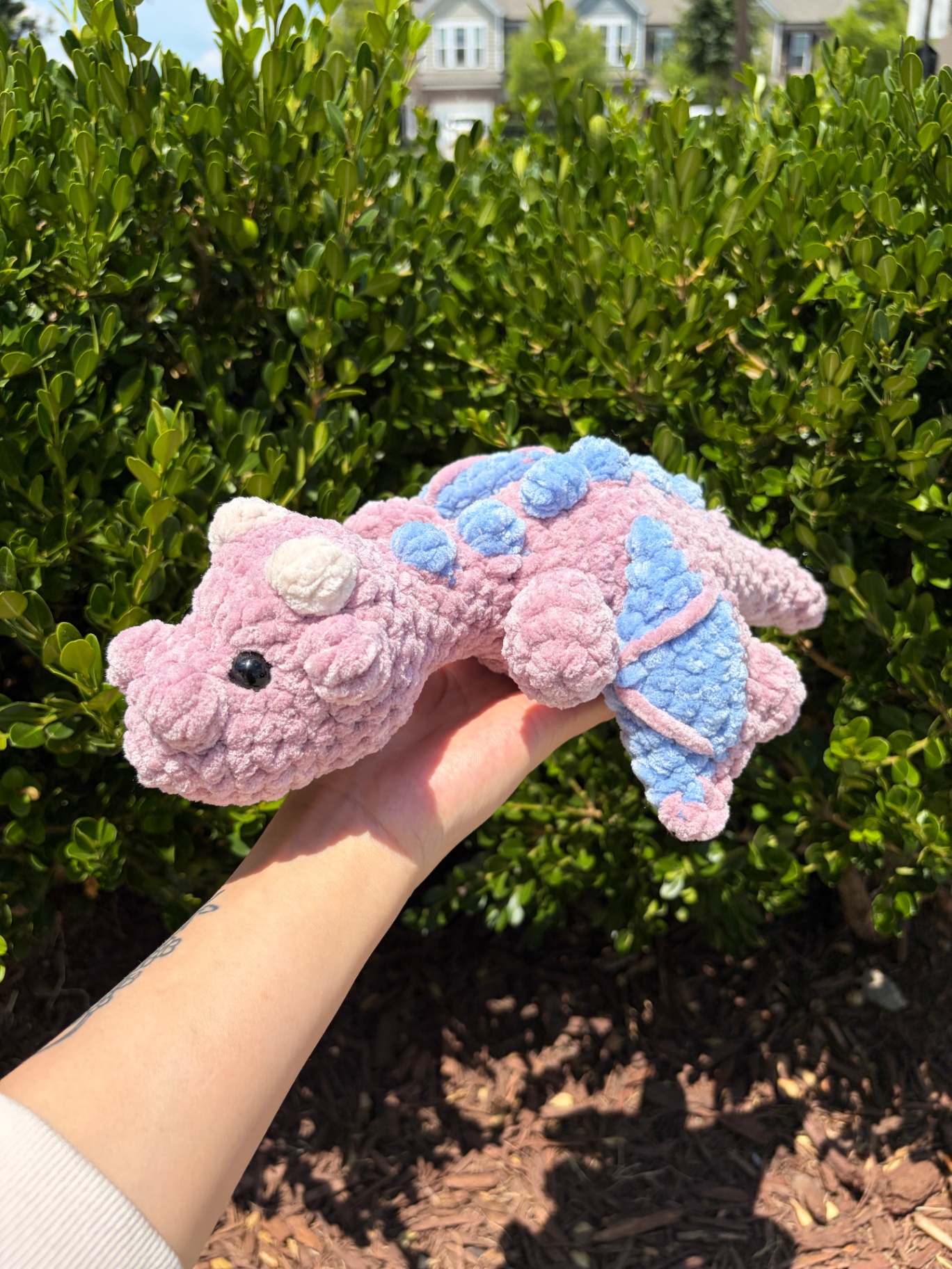 Pink and blue crochet dinosaur plushie
